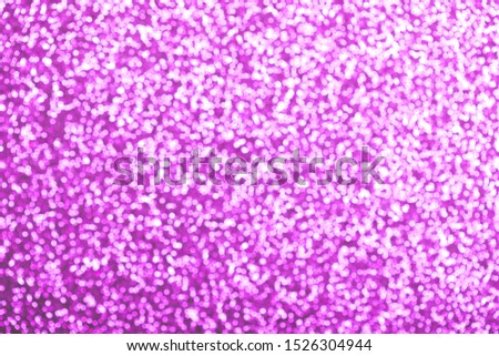 Abstract background, defocused image with bokeh effect of purple color, festive xmas spirit