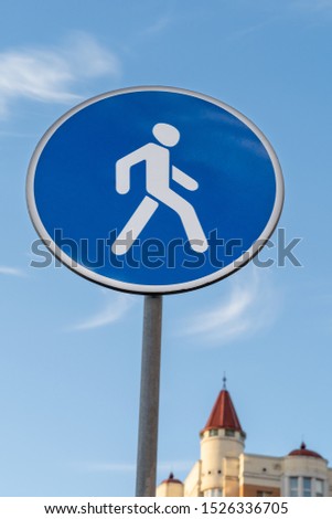 road sign pedestrian zone on a background of blue sky