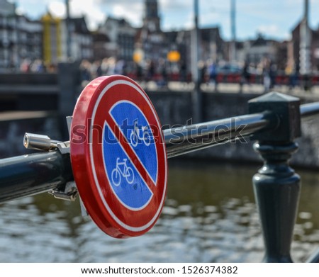 No Bicycle Parking Sign at the steel fence in Amsterdam, Holland.
