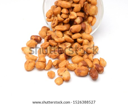 Composition from nuts on the white isolated background 