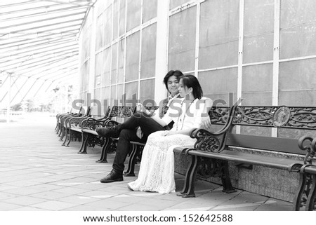 Couple sitting on the chair