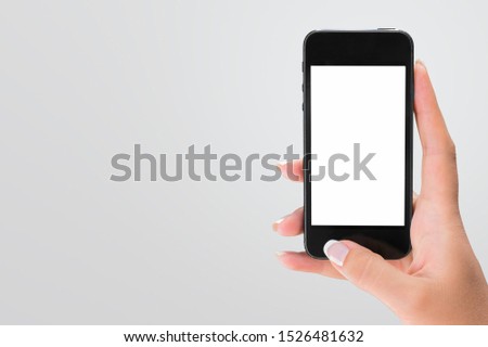 Young man hand holding phone