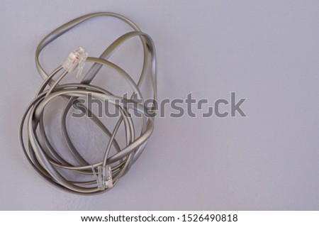 Gray telephone cable conector on white background. 