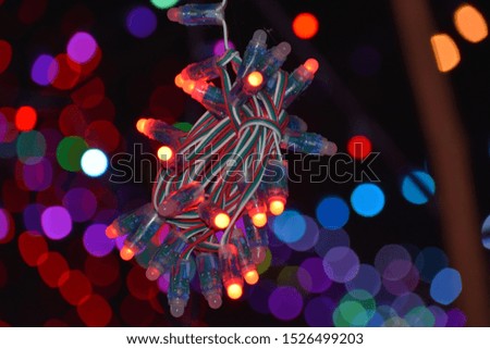 Outdoor string lights hanging on a line in backyard