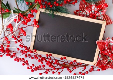 Chalkboard with colourful Christmas decorations 