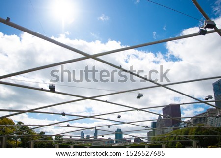 The Pritzker Pavillion in Chicago Illinois with Sunny Blue Sky and Skyline