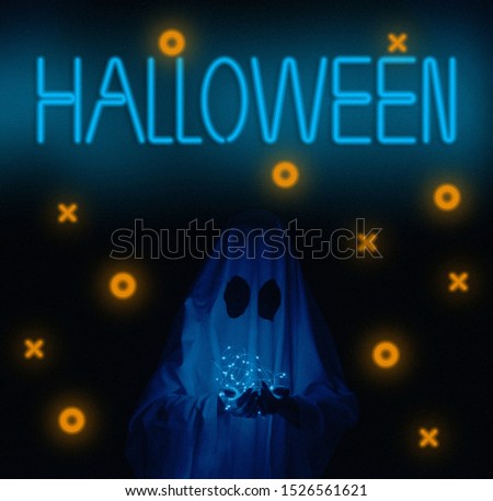 White ghost holding led garland on dark background neon sign Halloween.