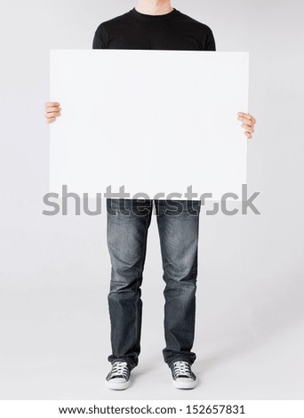 business and advertisement concept - man showing white blank board