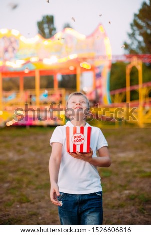popcorn fireworks joy and emotions child outside festival fair with colorful background