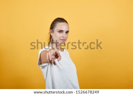 Girl pointing on someone as she believes in that person either person is the one whom she is concerned with sign of dependency. Also particularity of individual
