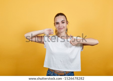 Photograph of girl expresses reaction or response about something which is just fair neither good nor bad. Restaurant reviews also can be related best way to react to something