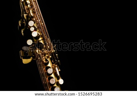 soprano saxophone on black background Royalty-Free Stock Photo #1526695283