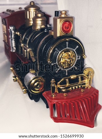 The old train. Classic, vintage style photo. Toy close-up. Idea for postcard