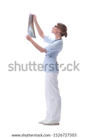 woman doctor looking at x-ray. isolated on white