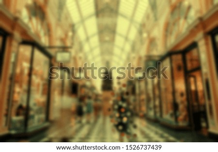 Blur store with bokeh background. Silhouettes of Business People in Blurred Motion Walking. Business people walking in the shoping center