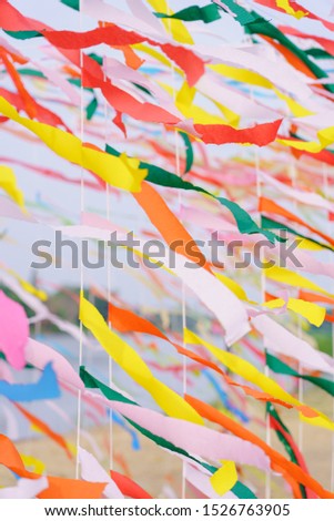 Texture of colourful yellow orange blue pink color ribbon decorated . Abstract  pattern background.
