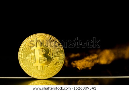 Gold bitcoin on black background.Bitcoin and New Virtual money concept.