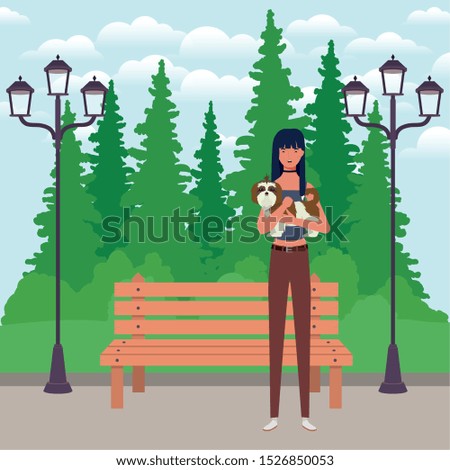 young woman lifting cute dog in the park vector illustration design