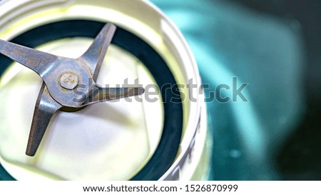close up metal stainless steel blade of blender macro photography isolated on white background