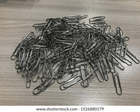 Many used paper clips that are recycled