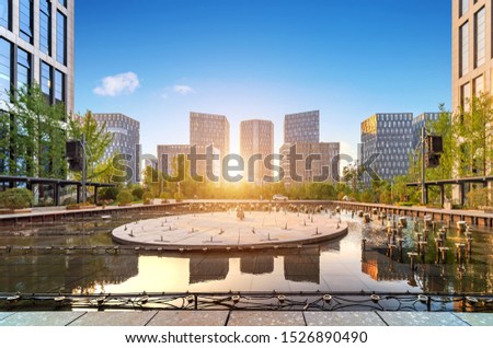 Park plants and modern architecture, Jinan Cityscape, China. Royalty-Free Stock Photo #1526890490
