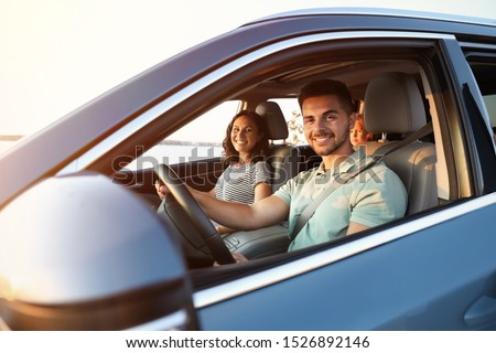 Happy family traveling by car on summer day Royalty-Free Stock Photo #1526892146