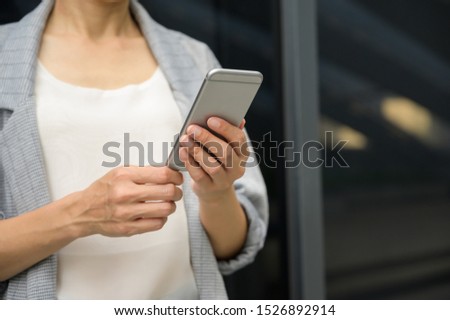 Close up. Young asian woman using smart phone. searching or social networks concept.