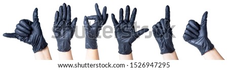 hands in black gloves on a white background a set of gestures