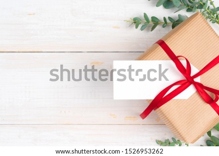 Christmas composition with Christmas gift on wooden background