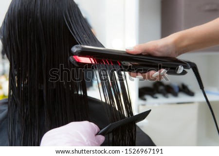 Keratin recovery hair and protein treatment pile with professional ultrasonic iron tool.