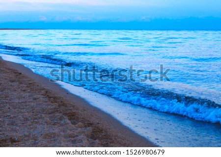 sandy beach and blue sea wave. Beautiful natural background. Tourism and travel