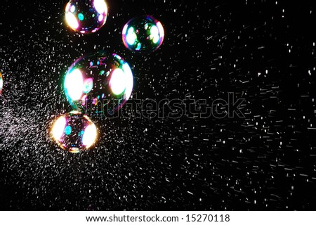 colored soap bubbles on black
