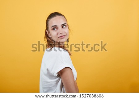 Girl posing as she is in studio for photoshoot