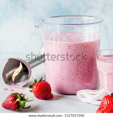 Strawberry Smoothie Blended with Hand Blender in a Measuring Cup, square