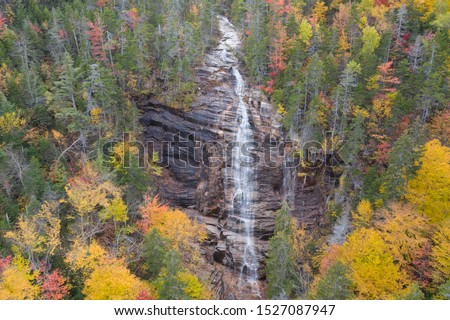 Arethusa Falls waterfall in New Hampshire during fall season. Aerial drone shot from above. Royalty-Free Stock Photo #1527087947