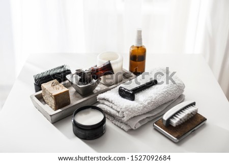 Man spa accessories to shaving and grooming lying on a clean white background, flat lay, top view Royalty-Free Stock Photo #1527092684