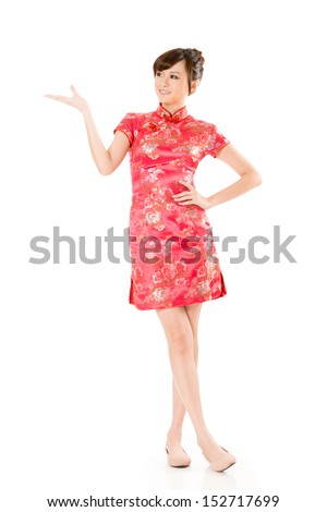 Smiling Chinese woman dress traditional cheongsam and introduce on white background.