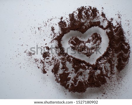 heart painted on coffee on white background