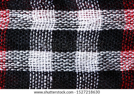 Bright cloth background. Closeup of black and white Middle East fabric