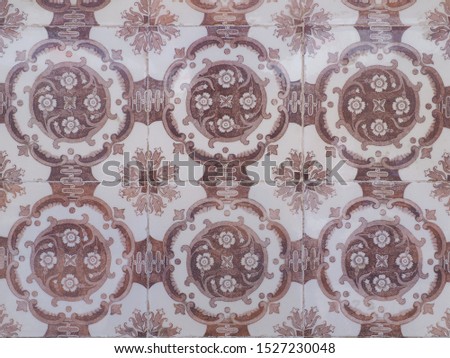 Azulejo white brown ornate pattern, for design or backdrop. Ornamental art form of traditional Portuguese and Spanish tin-glazed ceramic tilework. Abstract background from old decorative painted tiles