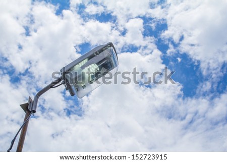 street light pole with a blue sky background