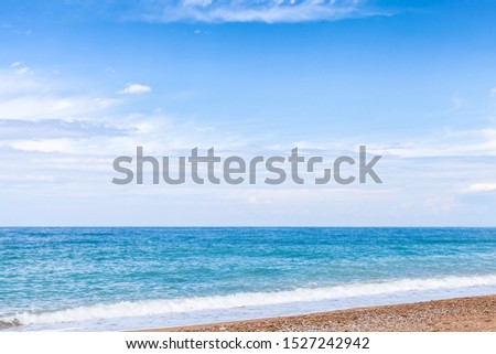 Empty beach background photo, natural summer landscape, sandy sea coast under cloudy blue sky