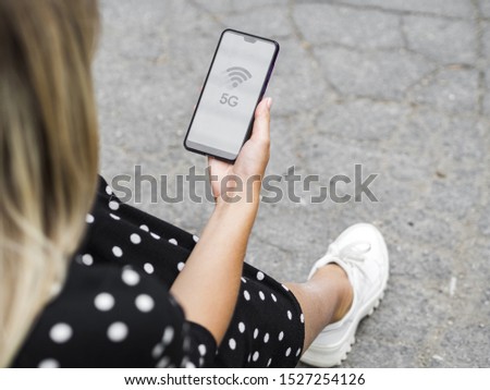 Woman looking at phone screen
