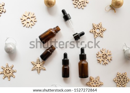 natural cosmetic skincare bottle container and oil serum on white background. Home made remedy and beauty product concept.Flat lay,winter care.
