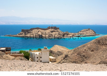 Pharaoh's island, Salah El-Din castle view at red sea resort city Taba, South Sinai, Egypt Royalty-Free Stock Photo #1527276101