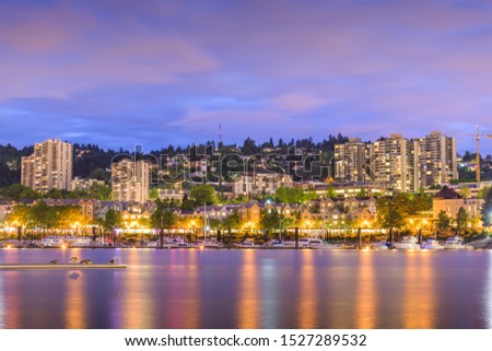 Portland, Oregon, USA apartment cityscape on the Willlamette River at night.