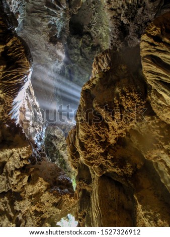 Light in a cave with an underground river