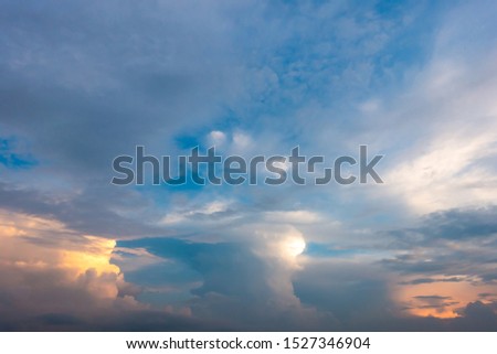 The background of the cloudys in the sky in the evening with the sunset light before storm. 