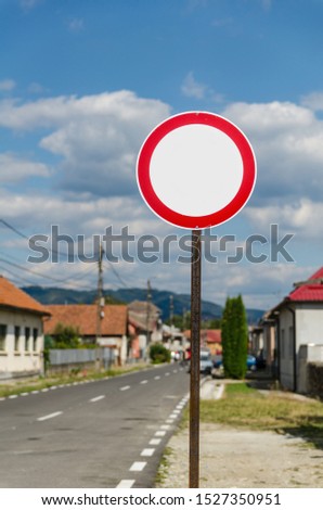 Stop street sign with urban blurry background