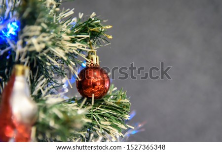 Christmas tree with different toys. Christmas tree. Christmas tree. The picture shows a fragment of a Christmas tree with different decorations.